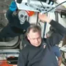 Russian cosmonaut Ivan Vagner wears an alien mask